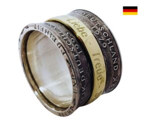 "Gestalte deinen eigenen Spinning Ring aus original DM Münzen mit Wunschgravur!"<br>wurde zur Wunschliste hinzugefügt