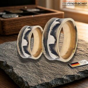 "Trauringe Sandguss Silber | Handgefertigte Eheringe mit Gold"<br>wurde zur Wunschliste hinzugefügt